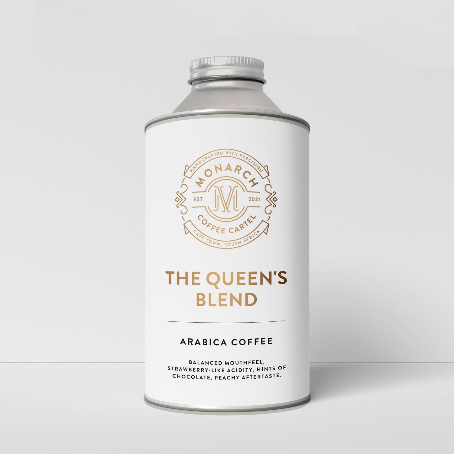 A cylindrical container with a label reading 'The Queen's Blend, Arabica Coffee'. It has a decorative border and specifies the coffee roast as 'Medium'.