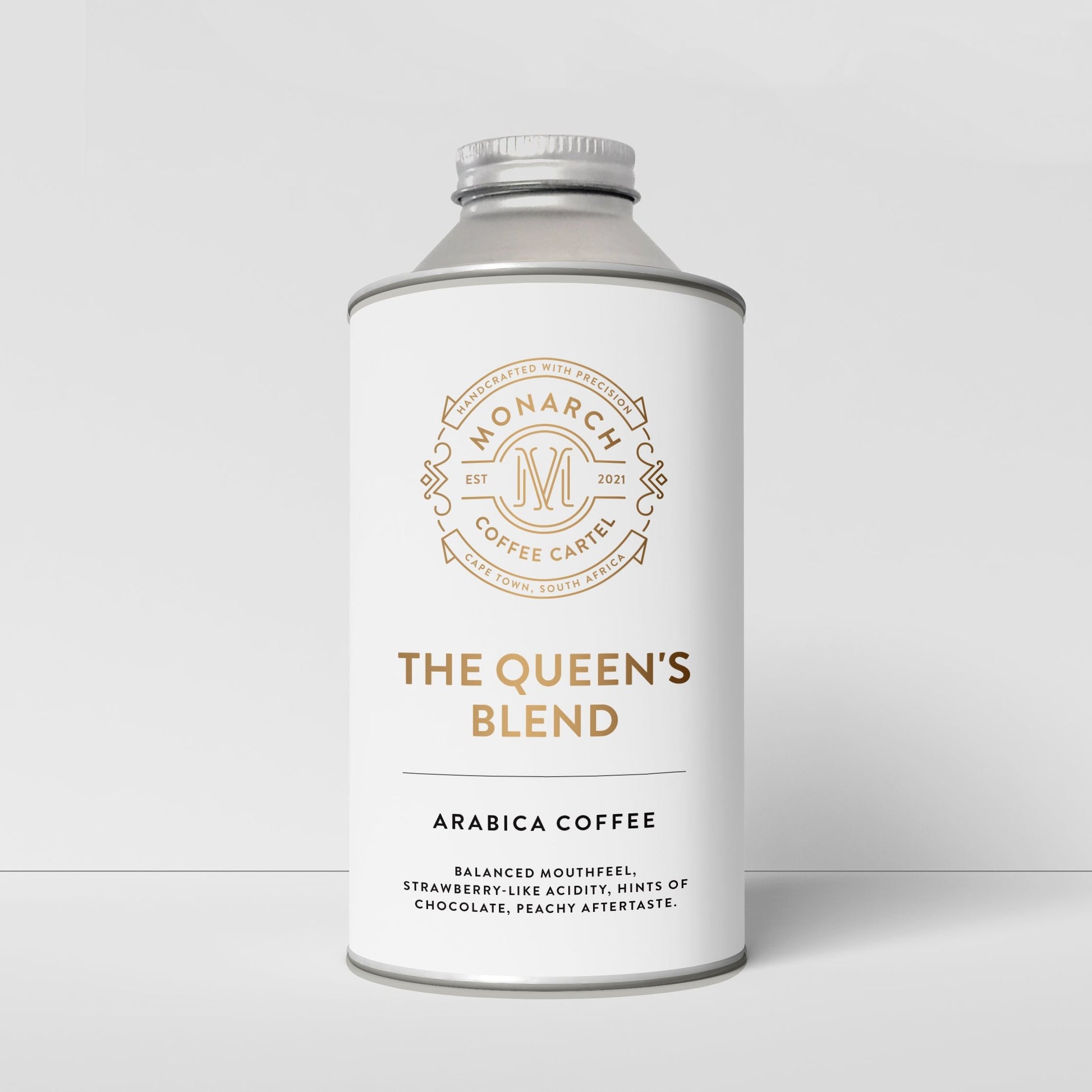 A cylindrical container with a label reading 'The Queen's Blend, Arabica Coffee'. It has a decorative border and specifies the coffee roast as 'Medium'.