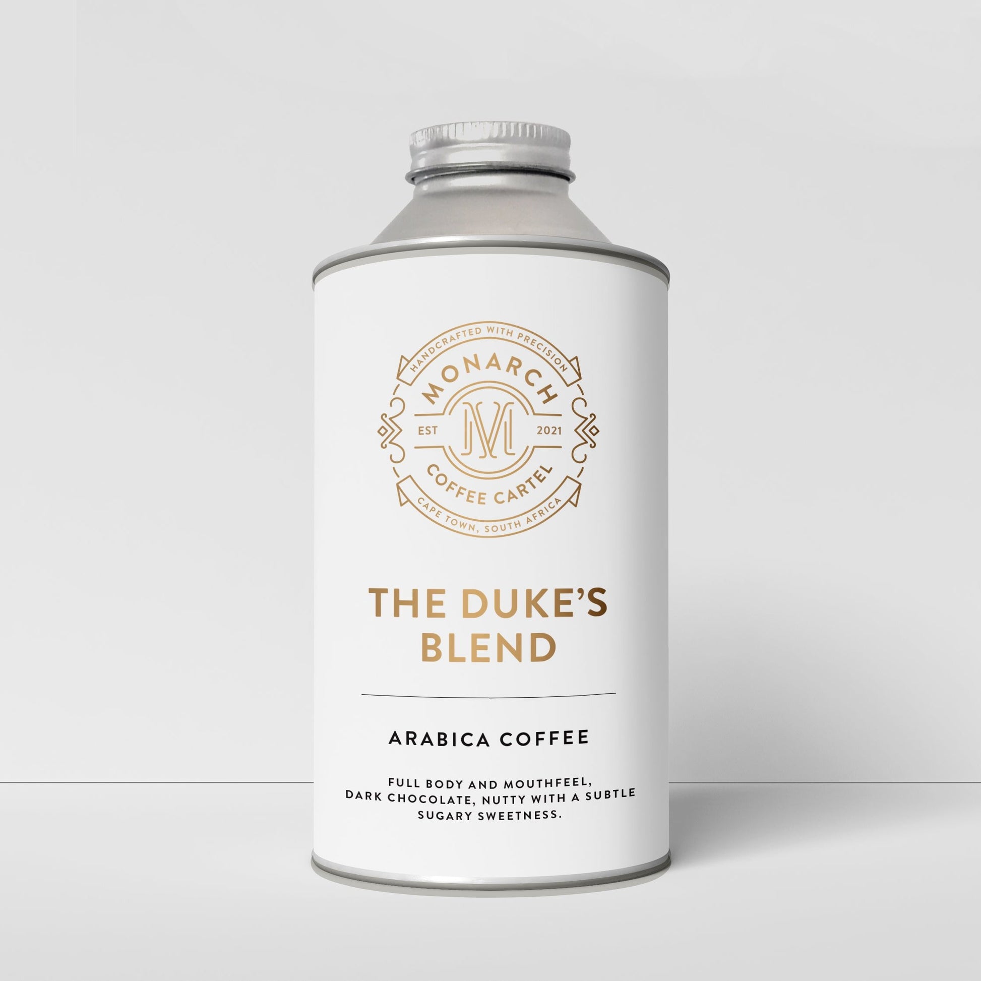 A container of Monarch Coffee Cartel's The Duke's Blend Arabica coffee with branding and product information displayed on the label.