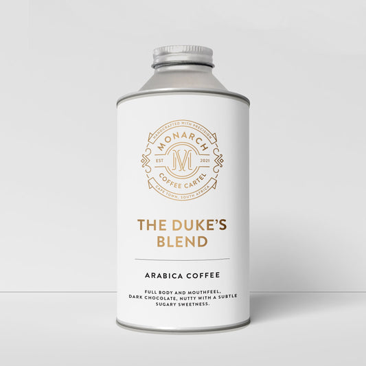A container of Monarch Coffee Cartel's The Duke's Blend Arabica coffee with branding and product information displayed on the label.
