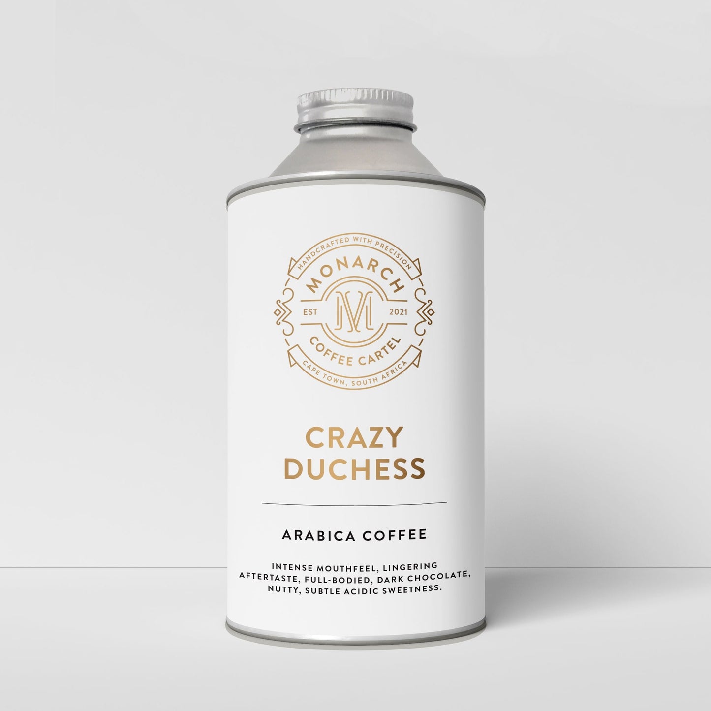 A bottle-like container with a label that reads 'Crazy Duchess' and 'Arabica Coffee', along with the Monarch Coffee Cartel logo.
