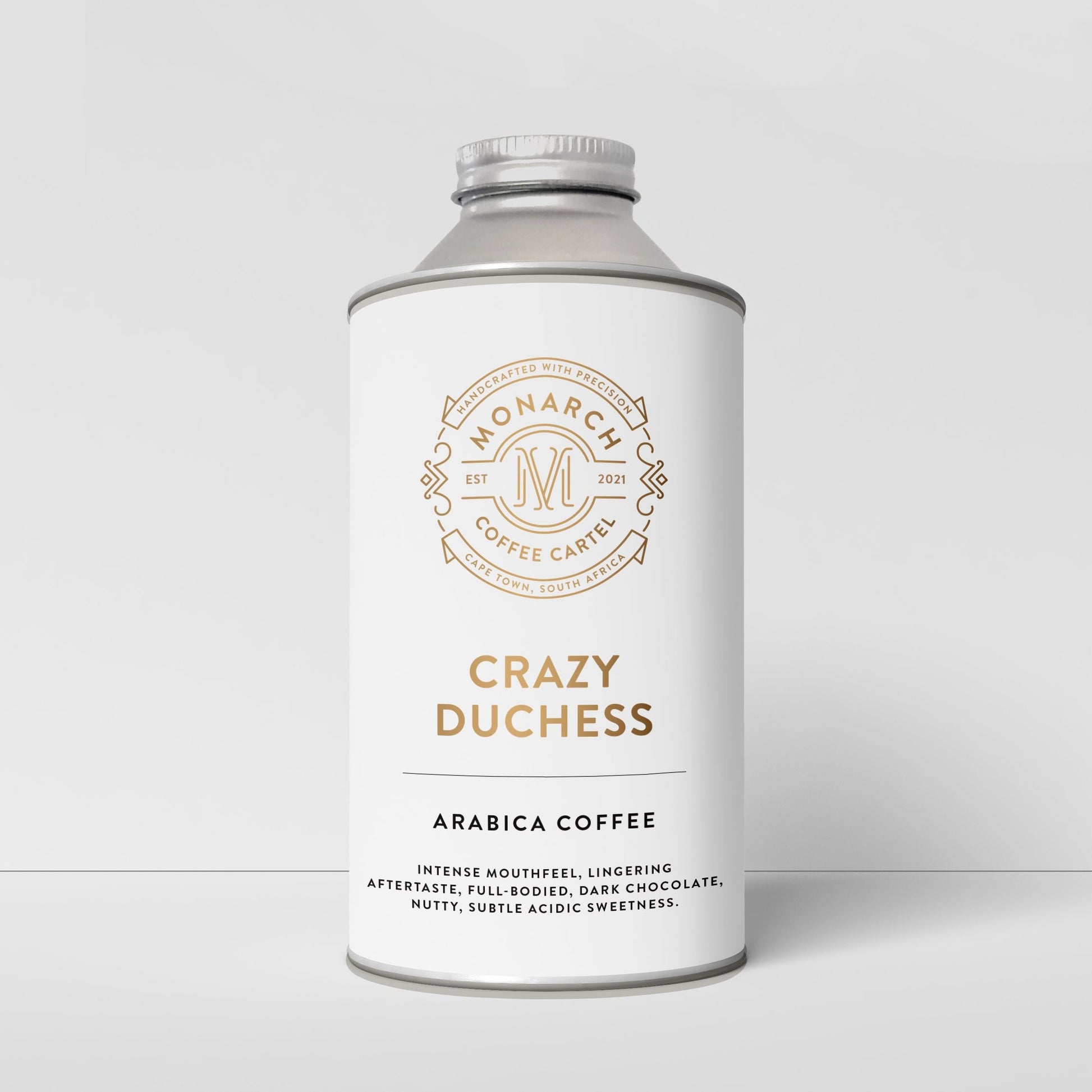 A bottle-like container with a label that reads 'Crazy Duchess' and 'Arabica Coffee', along with the Monarch Coffee Cartel logo.