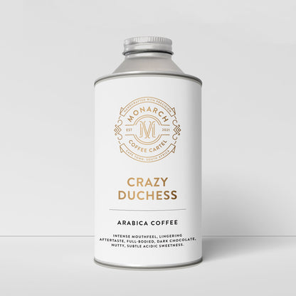 A bottle-like container with a label that reads 'Crazy Duchess' and 'Arabica Coffee', along with the Monarch Coffee Cartel logo.