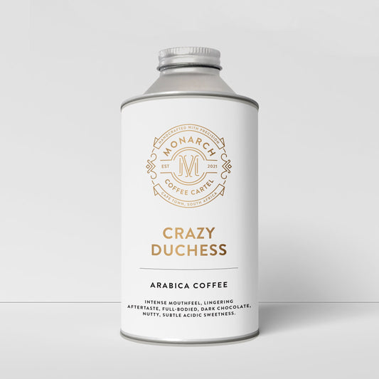A bottle-like container with a label that reads 'Crazy Duchess' and 'Arabica Coffee', along with the Monarch Coffee Cartel logo.